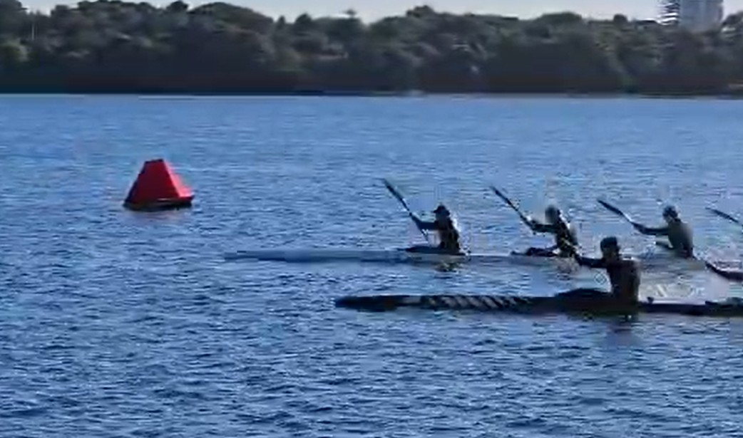 Paddlers racing past a Sentenal course mark